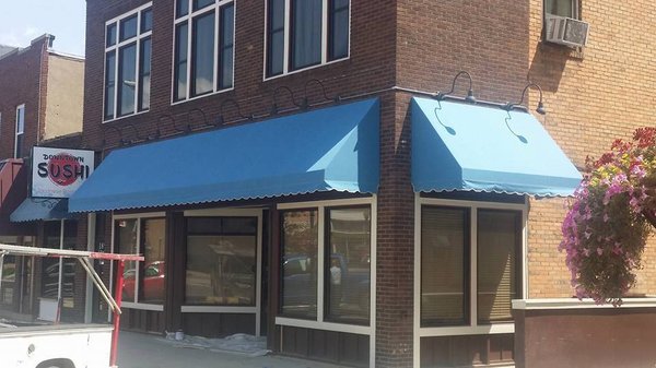 Aluminum framed awning covered in Sunbrella canvas.