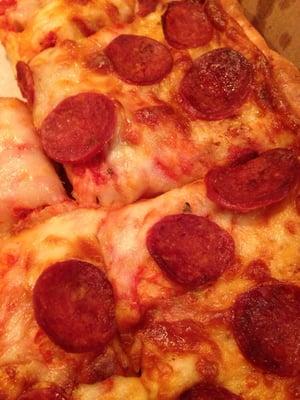 Sheet pizza with pepperoni.