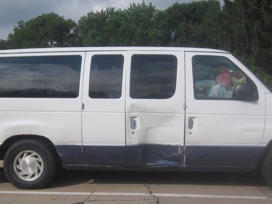 Van parked in the parking lot closest to 56th Street.