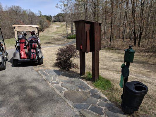 Hole 12 marker and ball washer. And water cooler. Woodlands Course.