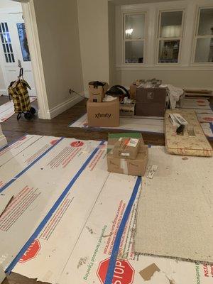 Living Room with "cardboard to protect the floors" for the movers (LOL)