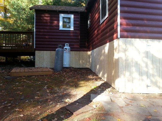 Enclosing crawl space under house