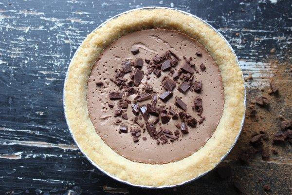 Paleo chocolate cream pie with handmade vegan chocolate chunks.