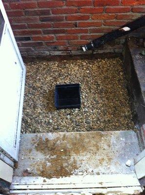 Stairwell drain being installed