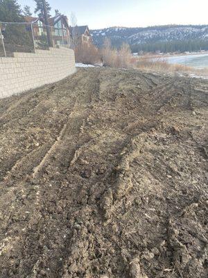 Retaining wall with a chain link fence on top of it