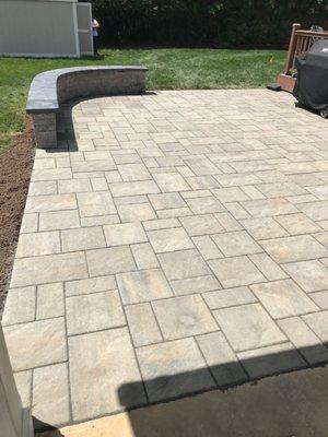 New paver patio with a durable, modern design, perfect for outdoor enjoyment. Professional and detailed work by JJ Basement and Yards.