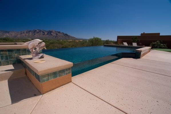 Stunning infinity edge pool with double wet glass walls