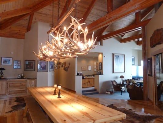 Beautiful dining area has hickory flooring, vaulted beam ceilings and open floor pattern. Granite & Stainless Kitchen too.