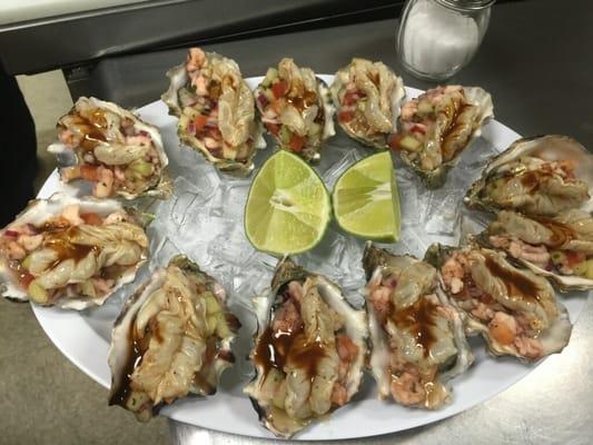 Options Malverde. A dozen oysters topped with fresh ceviche .