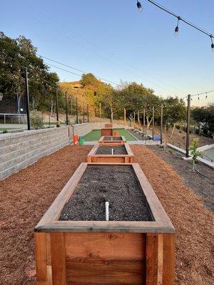 Redwood planter boxes, Allan Block Walls, Artificial Turf, light posts, lights