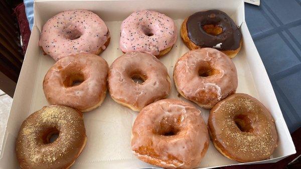 Strawberry glazed with sprinkles, chocolate glazed, glazed, and maple glazed.