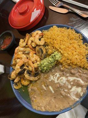 Shrimp Sautéed with garlic and mushrooms, beans, rice, and homemade flour tortillas.