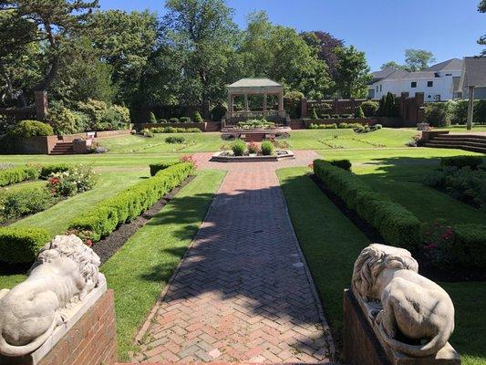 Beautiful heritage garden and architecture with lions standing guard.