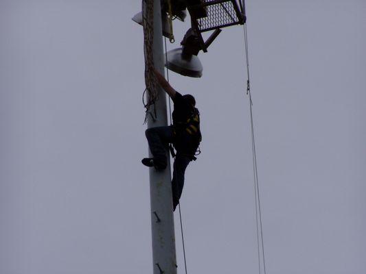 Almost done climbing to the top of the 120ft Stadium light pole tower