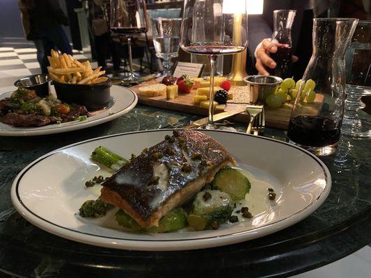 Salmon with a light sauce of lemon and crispy capers. Broccolini and Brussels sprouts