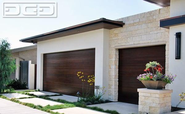 Wood garage doors custom designed and crafted in a modernistic and minimalistic style by Dynamic Garage Door (855) 343-3667