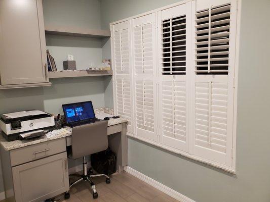 Plantation Shutters on windows by small office give me privacy, plus they look gorgeous!