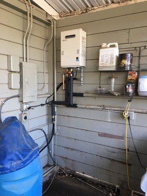 Tankless unit install outside of a barn in Green Valley