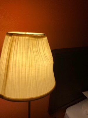 Almost destroyed lamp on the wall