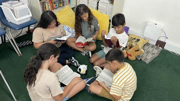 Students reading the Word of God