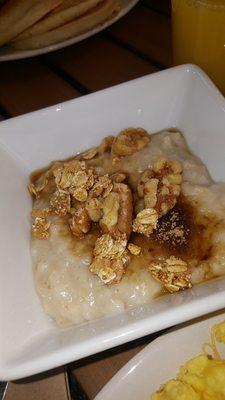 Hot oatmeal with sugar walnuts and granola