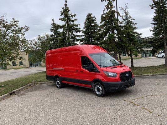 This Ford Transit was changed from white to 3M gloss red vinyl in the matter of days.