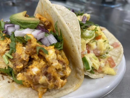 Delicious Breakfast tacos with green sauce on the side