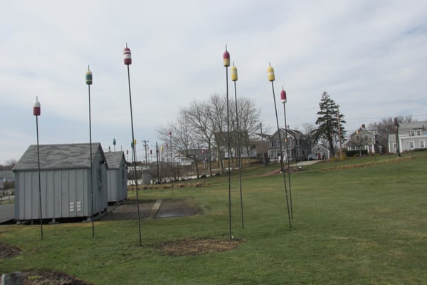 Old buoys on poles