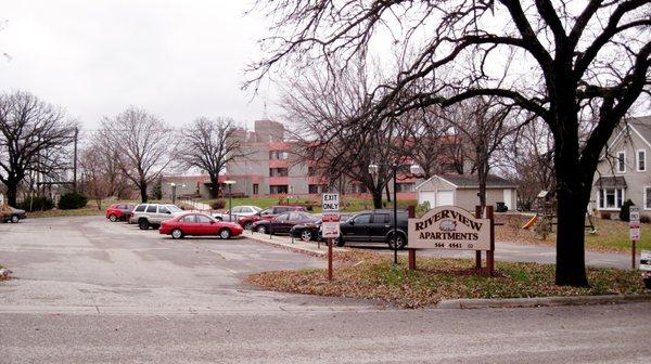 Residents get their own parking spots off the street in a well lit parking lot.