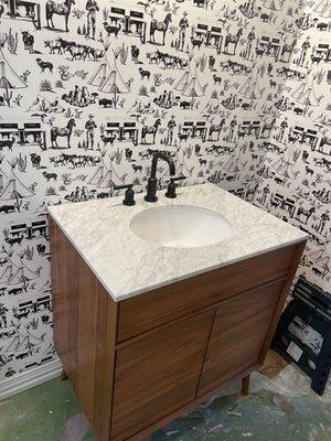 under-mount white sink with matte black faucet