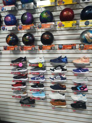 Different bowling balls and shoes