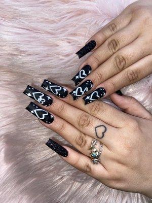 All black nail set with glitter nails , heart and stars nail art (air brush look )