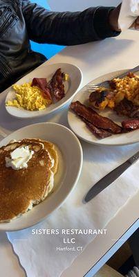 Pancakes, scrambled eggs w cheese, turkey bacon and home fries