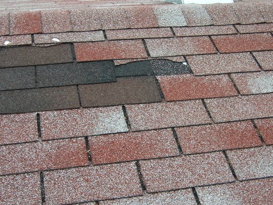 Patched in areas of roof shingles