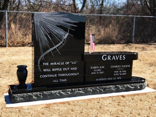 This memorial combines an upright monument with a bench monument.  Custom sandblast engraving