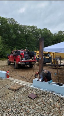 Welding foundation supports on a new home construction job in RI