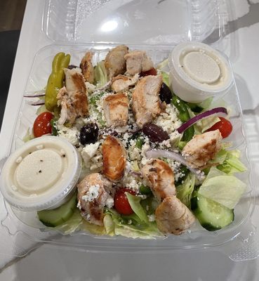 Greek salad with grilled chicken and it came with a delicious fresh warm pita