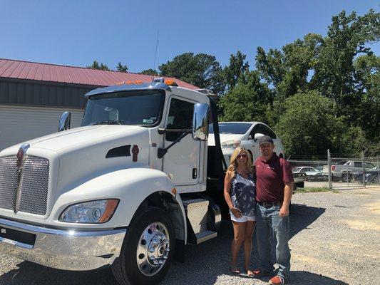 My wife and I at our business, Bama Pro Tow, LLC