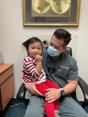 3 year old shows her clean teeth for everyone to see Dr. John did a great job