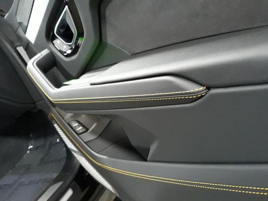 Yellow stitched door panel from a Lamborghini Urus