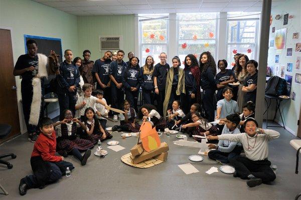 8th graders host 4th graders during a Beowulf Luncheon in celebration of both classes finishing the book