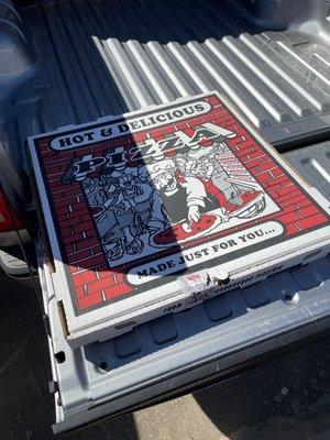 28" pizza box in the only place it would fit in the truck. The bed