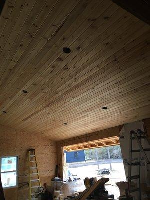 Custom tongue and groove wood cathedral ceiling in a Florida screen room.