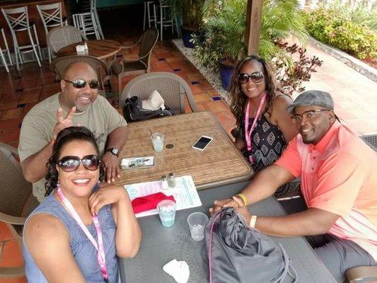 Group enjoying drinks on our Lovers or Friends Cruise to Bahamas