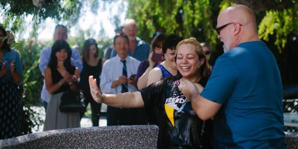 Baptism in the back courtyard of the church.