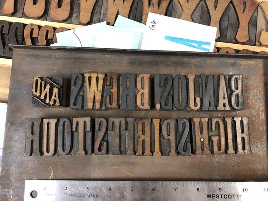 Megan set the headline by hand using vintage wood type