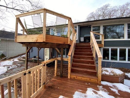 Extend your living space and enjoy the outdoors with a beautiful wooden deck from Wild Construction Inc.