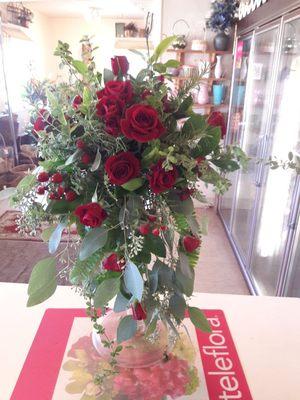 Bride's bouquet of fresh herbs, seeded eucalyptus burgandy petite roses, berries and woodland greens. Very fragrant