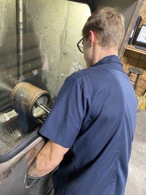 Technician cleaning a filter