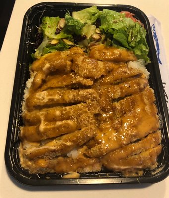 Tonkatsu dish. Huge portion and very tasty! Served on a bed of rice and with a small salad.